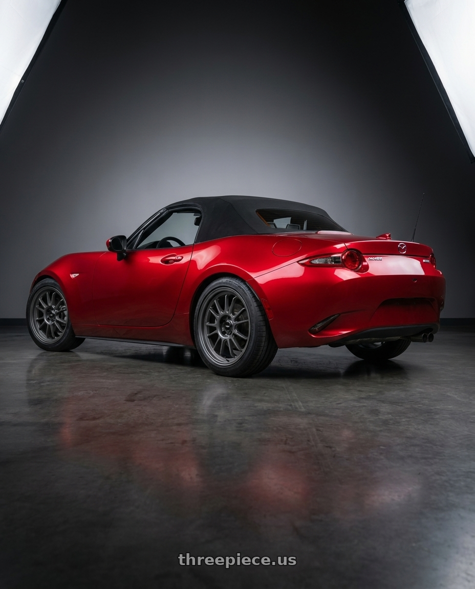 2016 Mazda Miata with Konig Hypergram 4x100 16x8+38 Matte Grey wheels rear three quarter view square tires