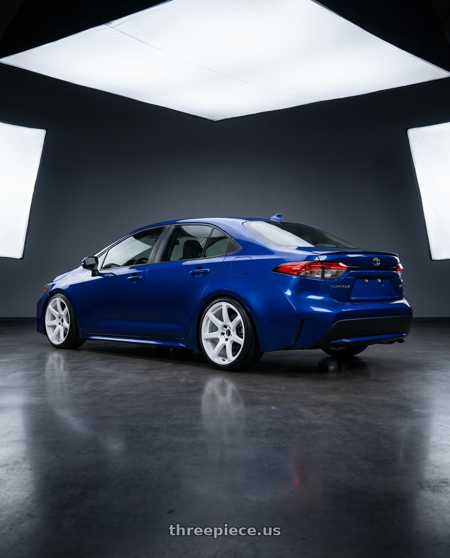 2021 Toyota Corolla  with Work Emotion T7r 5x100 18x9.5 +22 White wheels rear three quarter view slight stretch tires