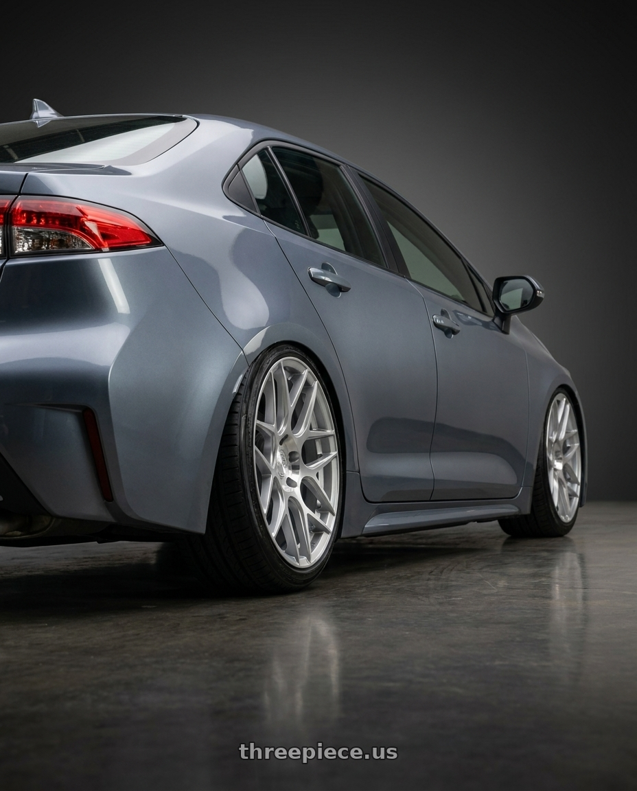 2025 Toyota Corolla with Aodhan AFF2 5x120 19x9.5+35 Gloss Silver Machined Face wheels rear three quarter view slight stretch tires