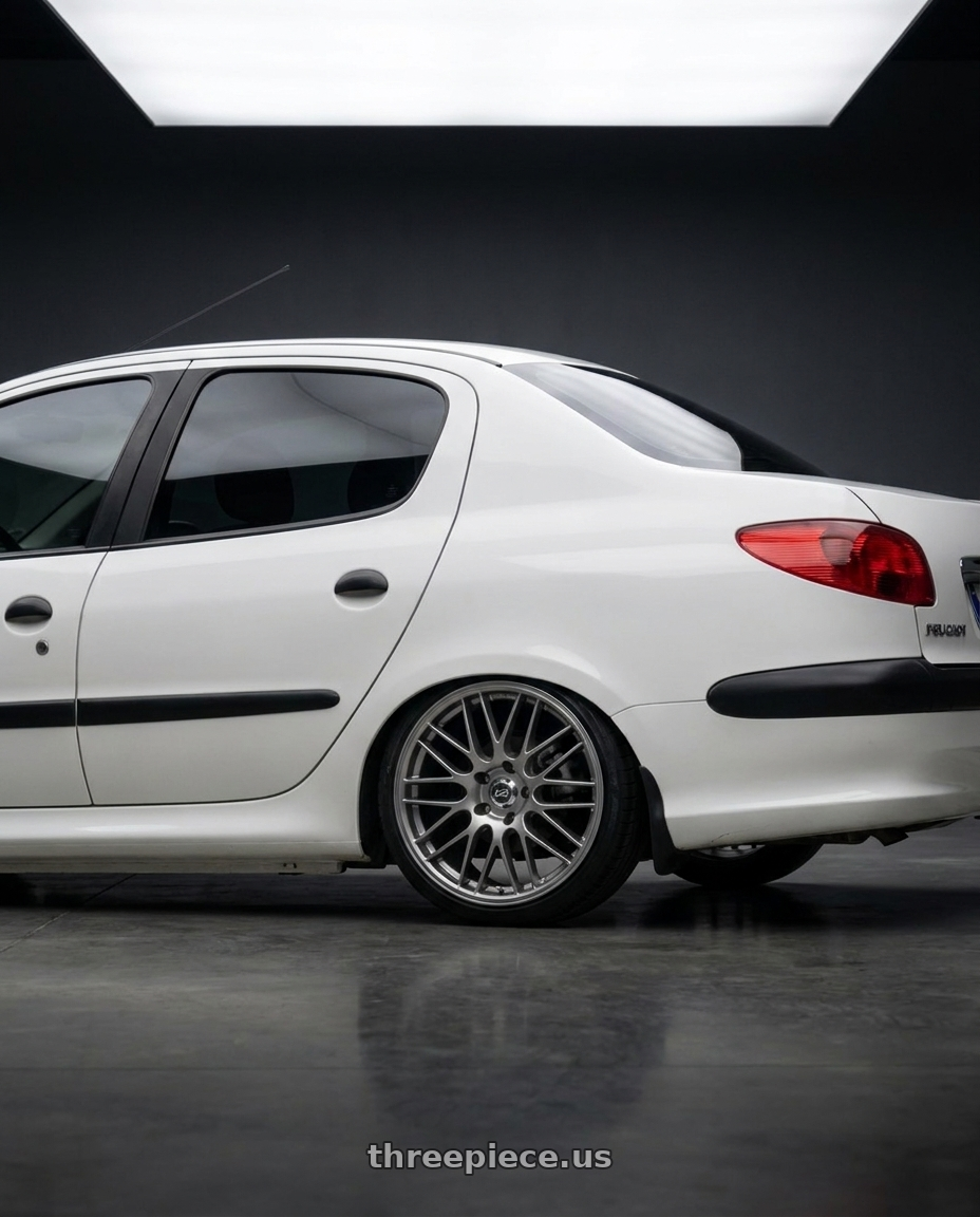 2011 Peugeot 206 SD with Enkei EKM3 5x100 17x7+45 72.8 Hyper Silver wheels rear three quarter view slight stretch tires