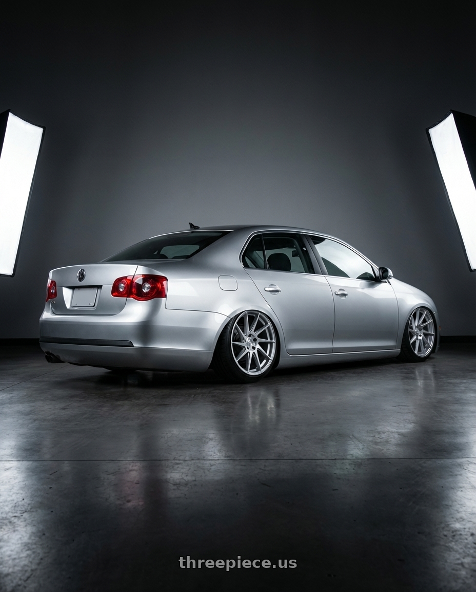 2009 Volkswagen Jetta GLI MK5 with Aodhan AH09 5x112 18x8.5 +35 Gloss Silver Machined Face wheels rear three quarter view slight stretch tires