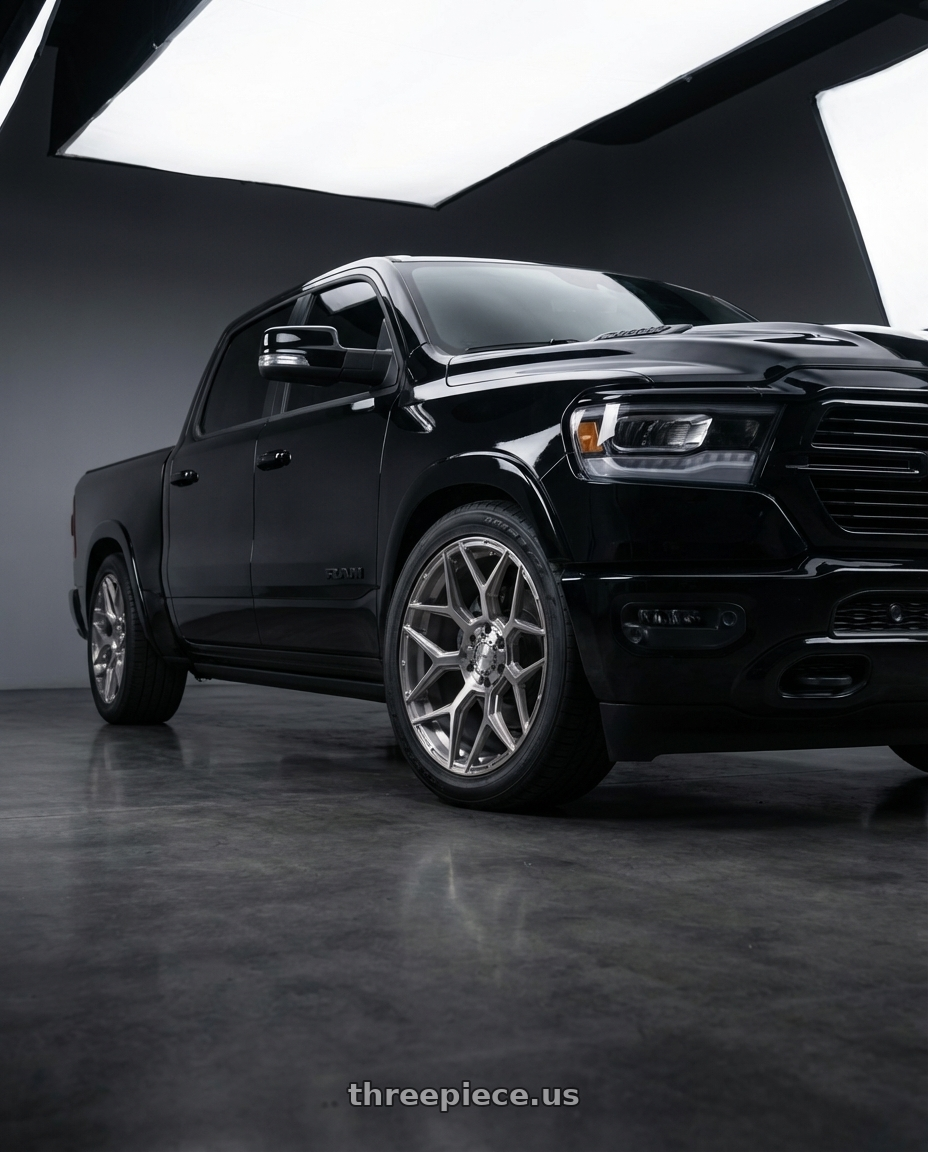 2022 ram 1500  with 4PLAY 4P06 6x135/6x139.7 24x10+18 Brushed wheels front three quarter view lowered stance