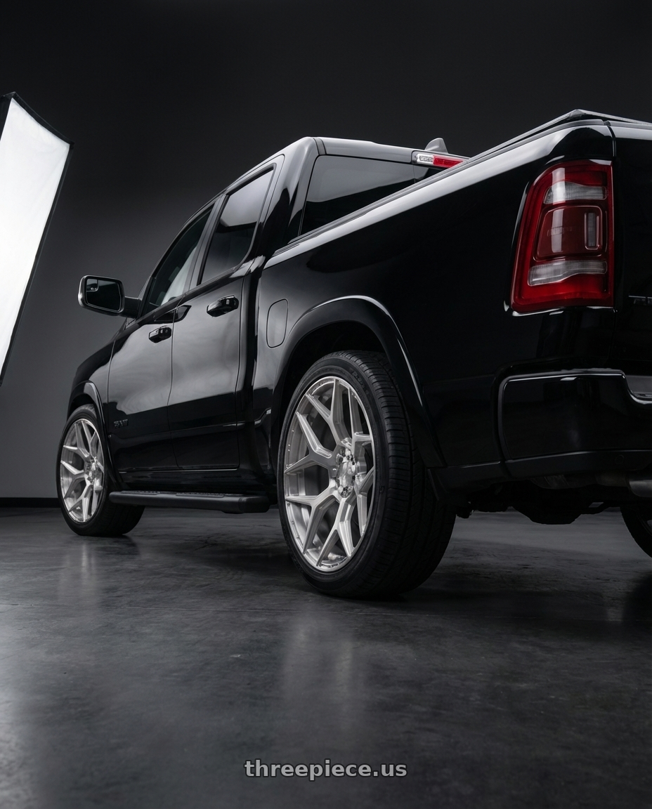 2022 ram 1500  with 4PLAY 4P06 6x135/6x139.7 24x10+18 Brushed wheels rear three quarter view square tires