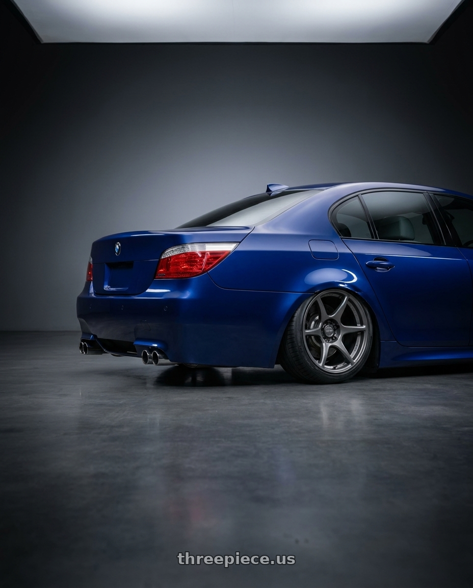 2010 BMW M5 E60 with Kansei K11G Tandem 5X120 19x10.5 22 Gunmetal wheels rear three quarter view slight stretch tires