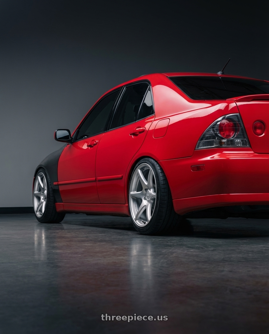 2003 Lexus IS300 with Kansei K11S Tandem 5x114.3 17x9 22 Hyper Silver wheels rear three quarter view square tires