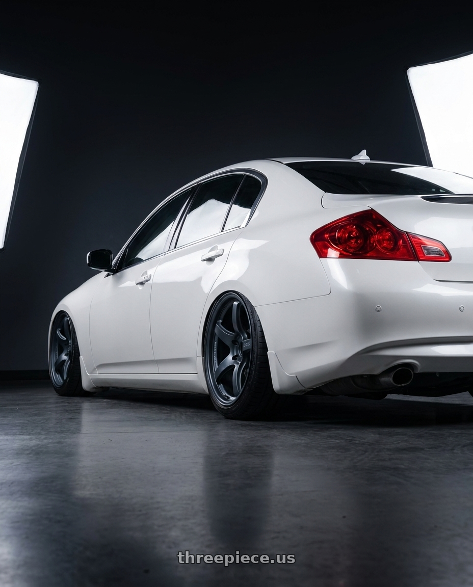 2012 Infiniti G37 with Gram Lights 57CR 5x114.3 19x8.5+35 Gunblue II wheels rear three quarter view slight stretch tires