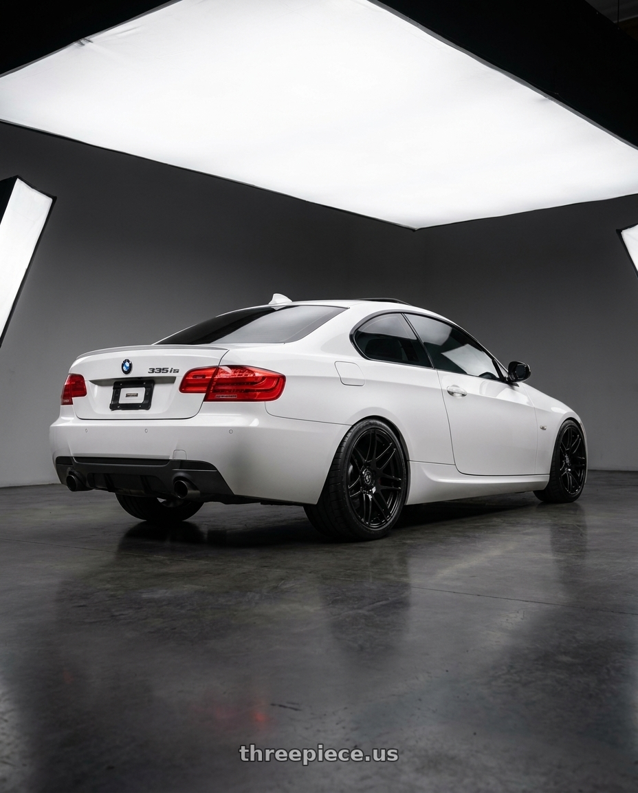 2012 BMW 335is with Forgestar F14 5x120 19x9 +38 Gloss Black wheels rear three quarter view meaty tires