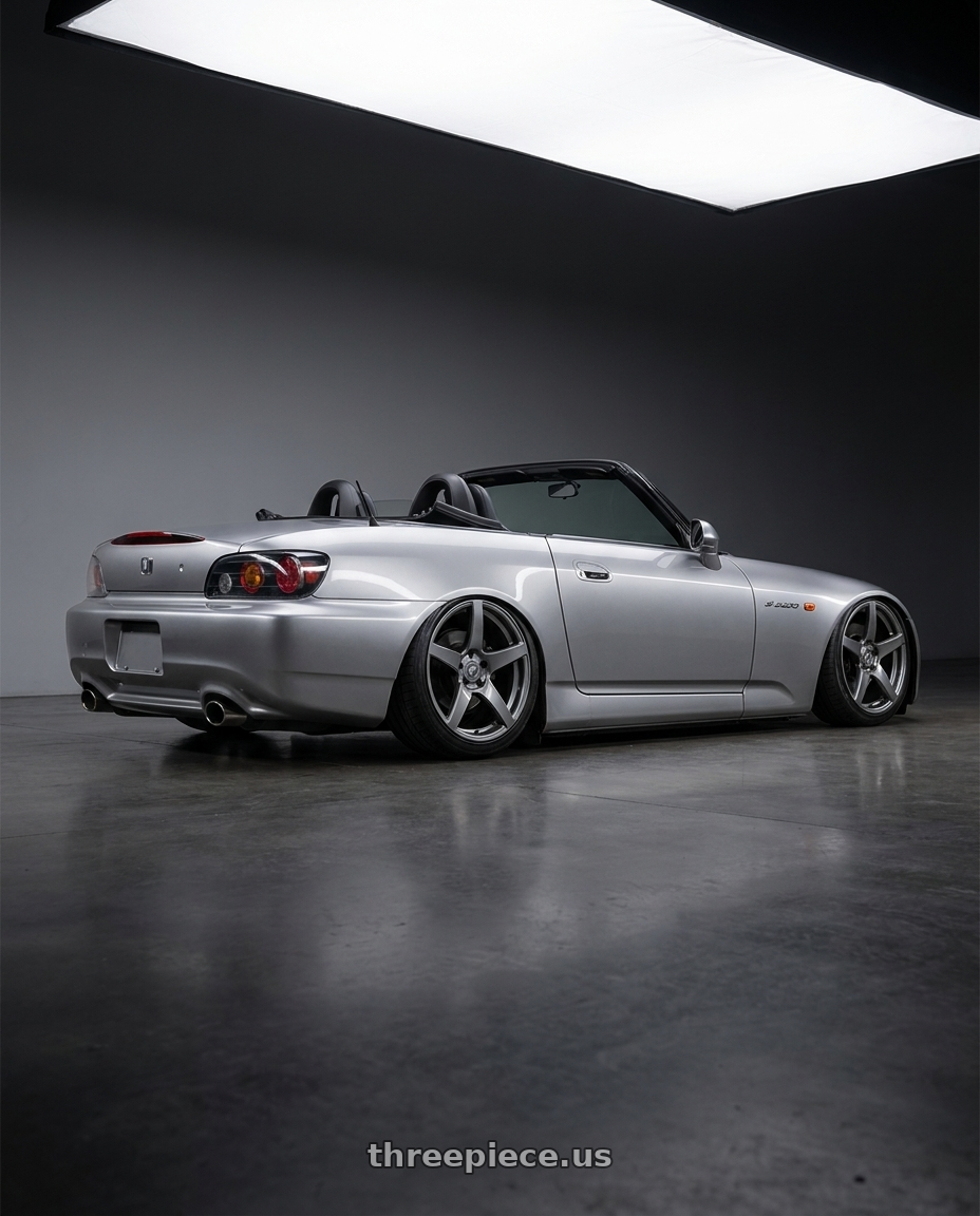 2009 Honda S2000 with Forgestar CF5 5x114.3 18x9 +35 Gloss Anthracite wheels rear three quarter view slight stretch tires