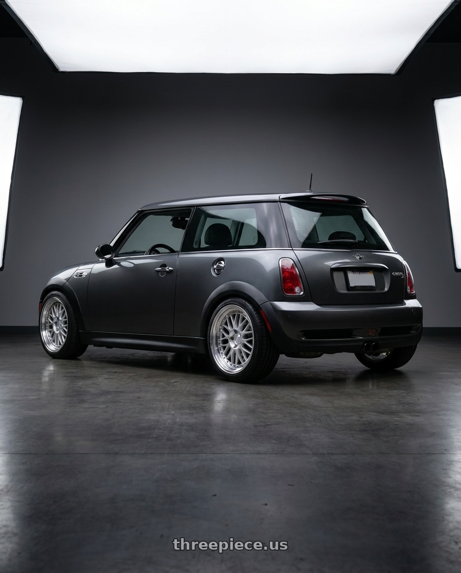 2005 mini cooper s with Aodhan AH02 4x100 / 4x114.3 17x8+35 Silver w/ Machined Lip wheels rear three quarter view square tires