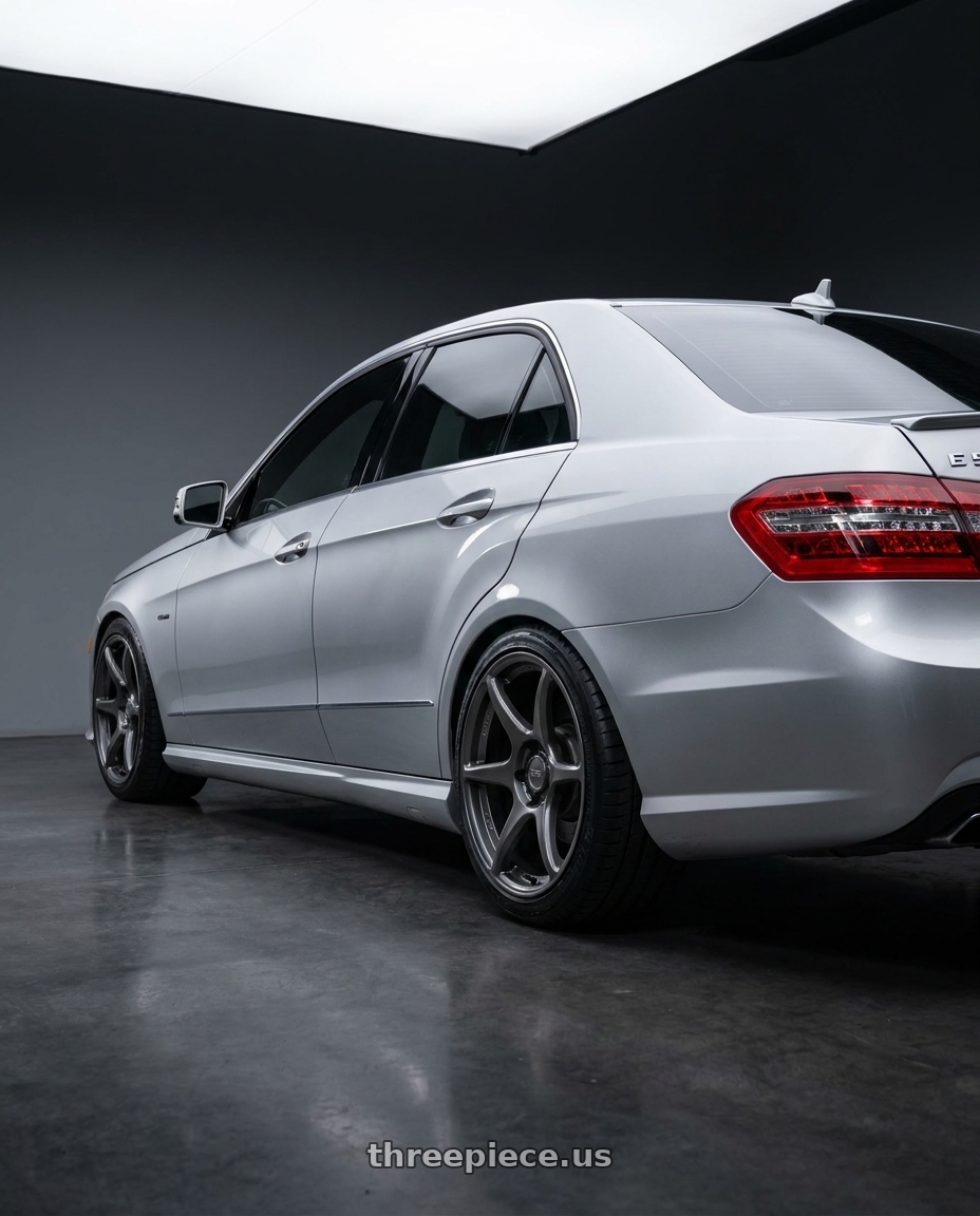 2010 Benz E550 with Kansei K11G Tandem 5X100 18x9 12 Gunmetal wheels rear three quarter view square tires