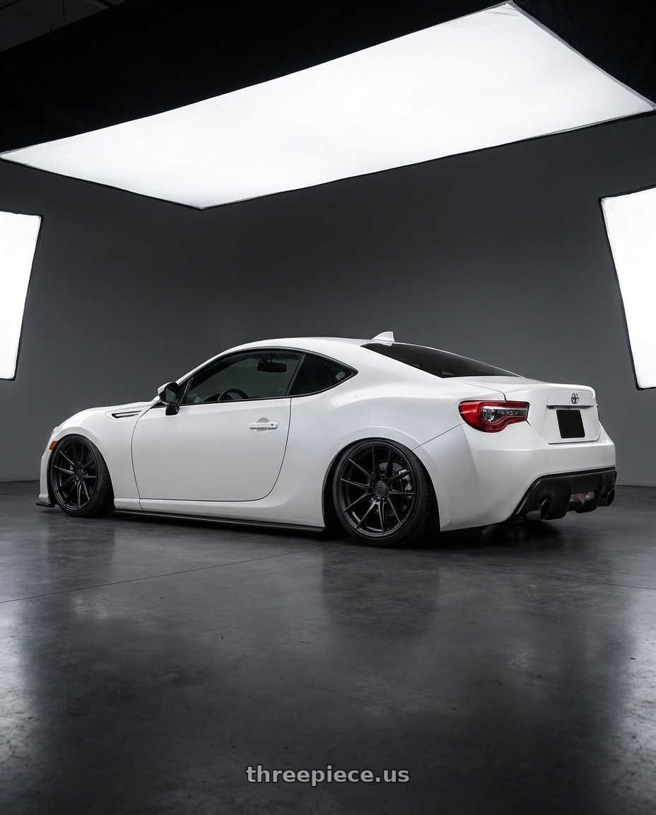 2016 Scion FR-S with Niche 1PC M117 MISANO 5X100 18X8 +40 MATTE BLACK wheels rear three quarter view slight stretch tires