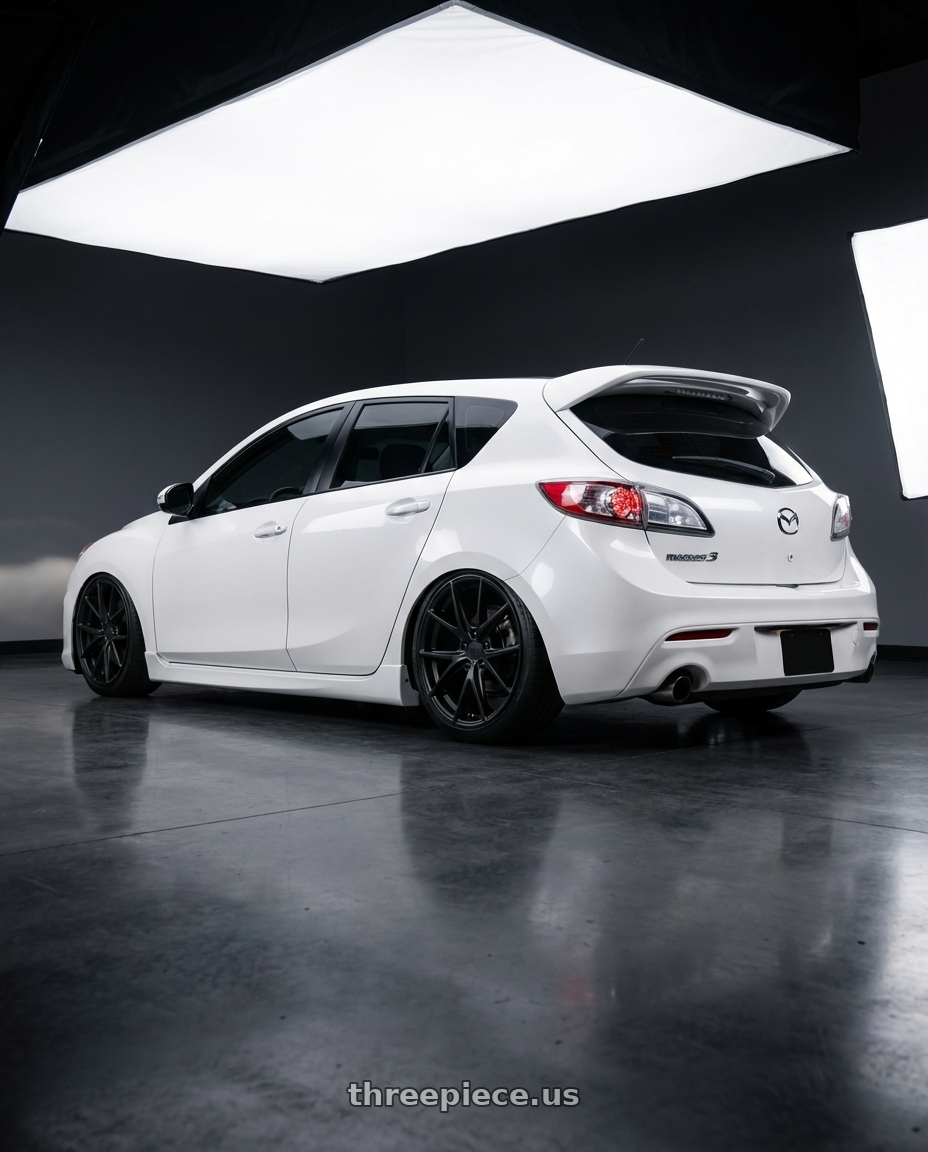 2012 Mazda Mazdaspeed3 with Niche 1PC M117 MISANO 5X114.3 18X8 +42 MATTE BLACK wheels rear three quarter view slight stretch tires