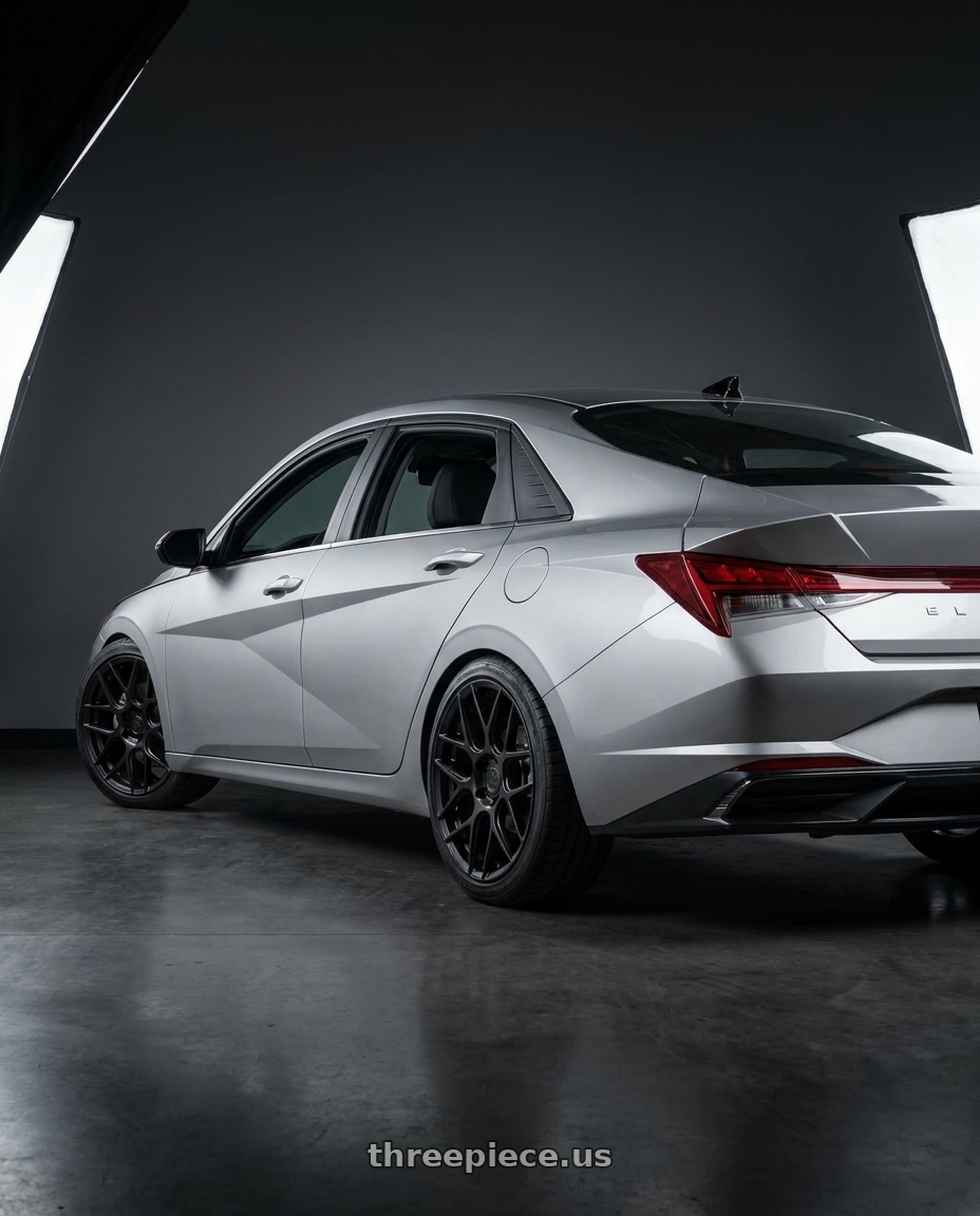 2021 Hyundai Elantra Limited with Aodhan AFF2 5x114.3 19x8.5+35 Matte Black wheels rear three quarter view square tires