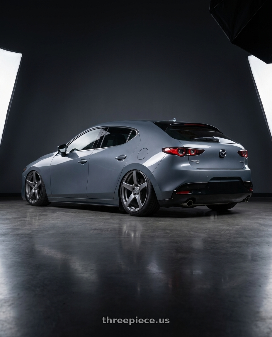 2023 Mazda Mazda3 Turbo with Forgestar CF5 5x114.3 18x9 +35 Gloss Anthracite wheels rear three quarter view slight stretch tires