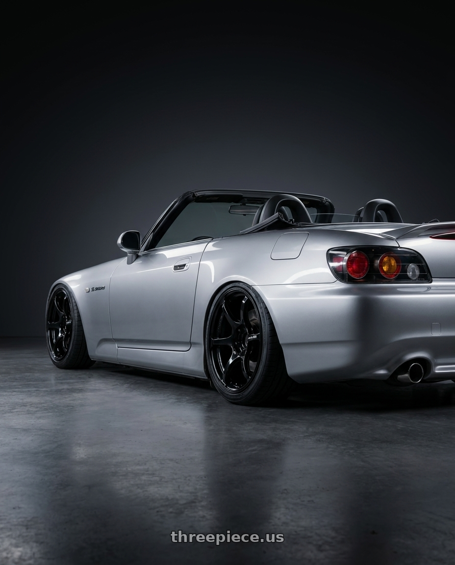 2009 Honda S2000 with Advan RGIII 5x114.3 18x8.5+31 Gloss Black wheels rear three quarter view slight stretch tires