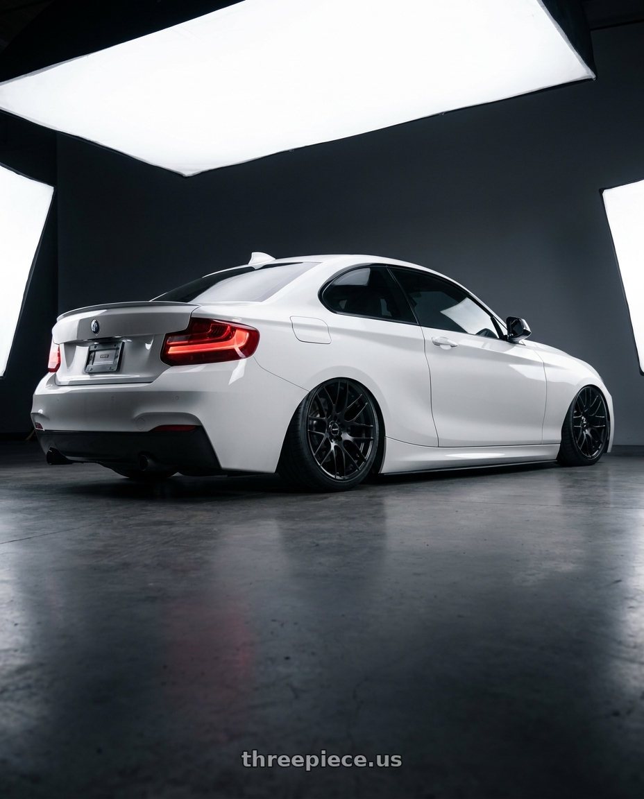 2018 BMW 2 Series F22 with Avant Garde Wheels M359 5X120 18x9.5 +33 Matte Black wheels rear three quarter view slight stretch tires