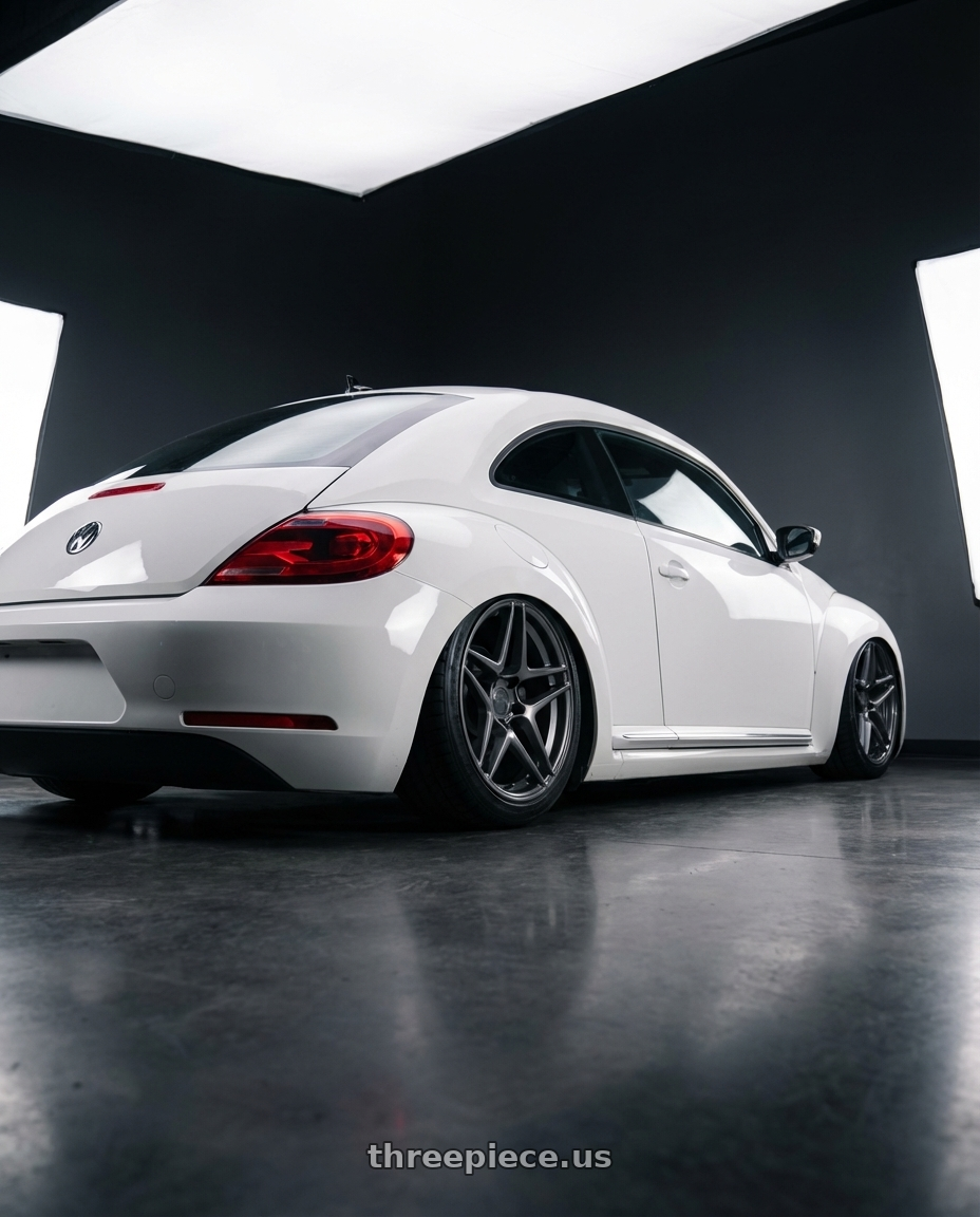 2016 Volkswagen Beetle Turbo with Kansei K15G Astro 5X112 19x9.5 35 Gunmetal wheels rear three quarter view slight stretch tires