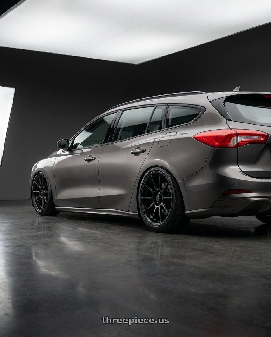 2024 Focus wagon mk45 with Advanti Racing 79B Storm S1 4X100 15x8 +25 Matte Black wheels rear three quarter view slight stretch tires