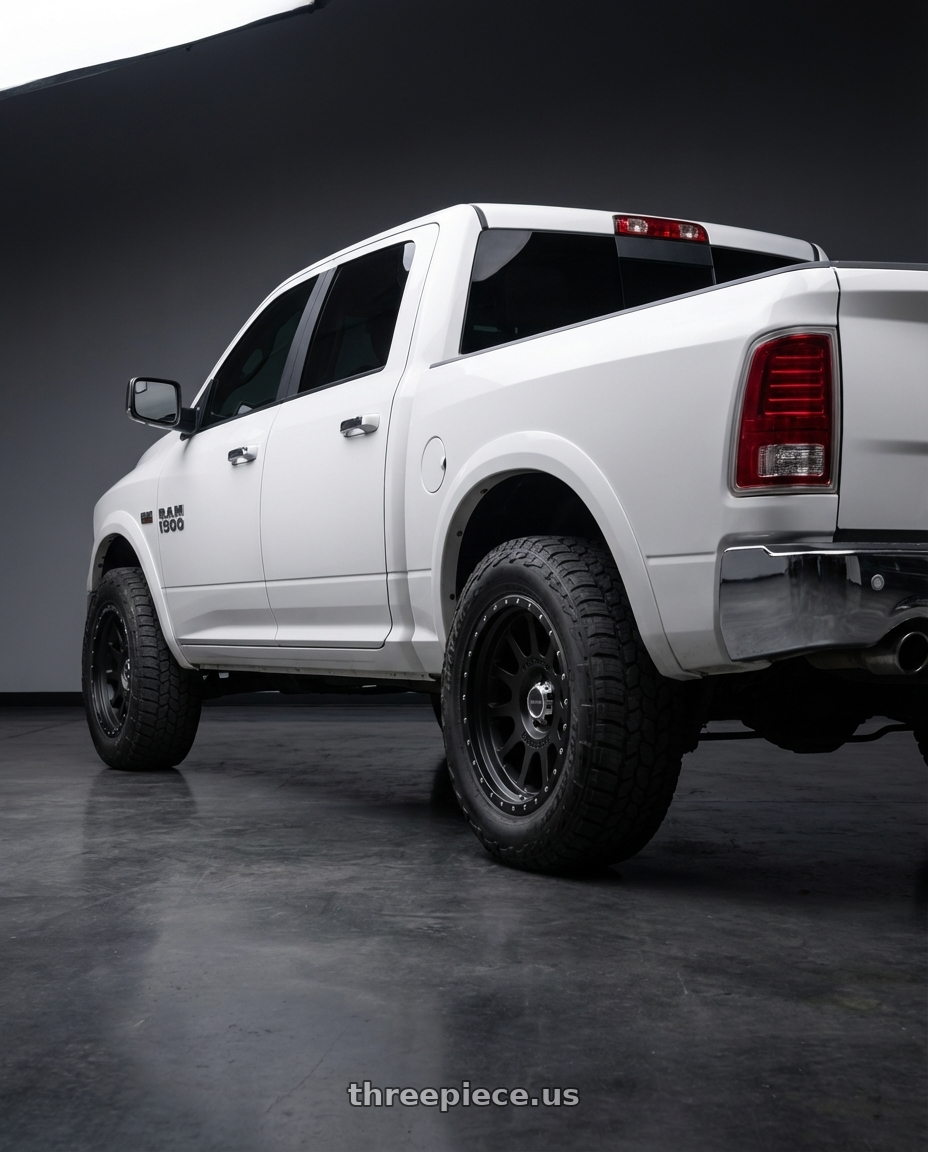 2016 dodge ram 1500 with Method Race Wheels 605B NV 8X170 20x9 -12 MATTE BLACK wheels rear three quarter view meaty tires