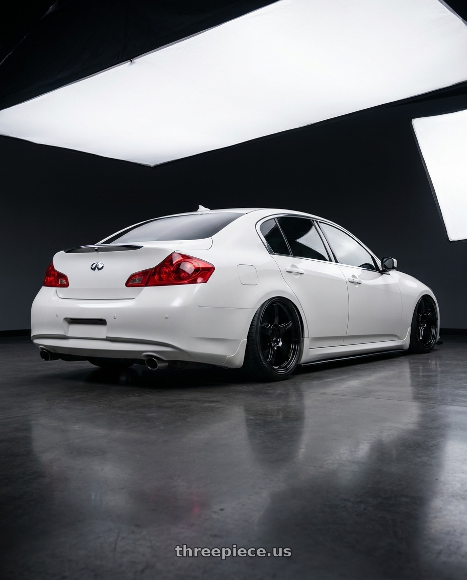 2012 Infiniti G37 with Gram Lights 57CR 5x114.3 19x9.5+35 Glossy Black wheels rear three quarter view slight stretch tires