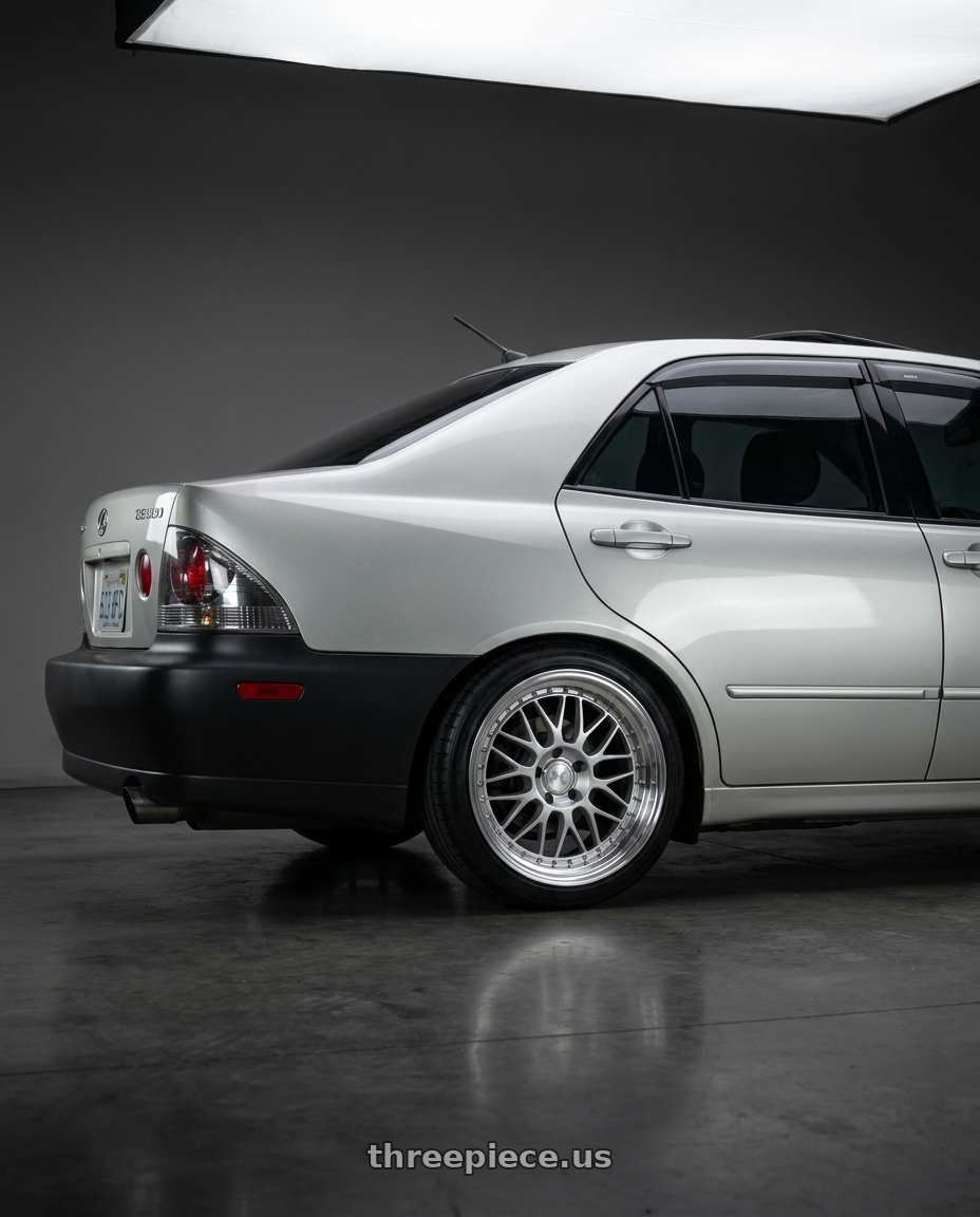 2001 Lexus is300 with Aodhan AH02 5x114.3 18x8.5+35 Silver w/ Machined Lip wheels rear three quarter view square tires