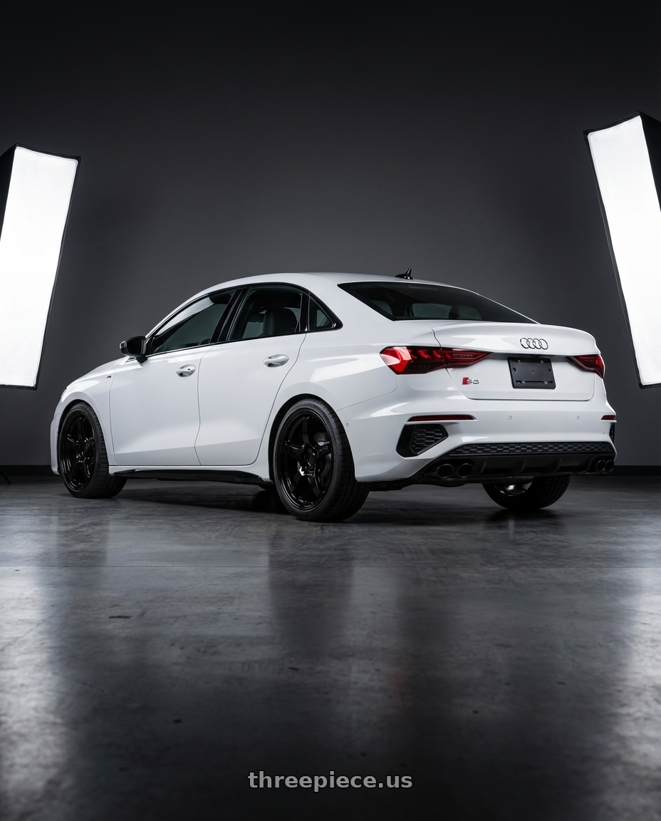 2024 Audi S3 8Y with Gram Lights 57CR 5x112 19x8.5+45 Glossy Black wheels rear three quarter view square tires