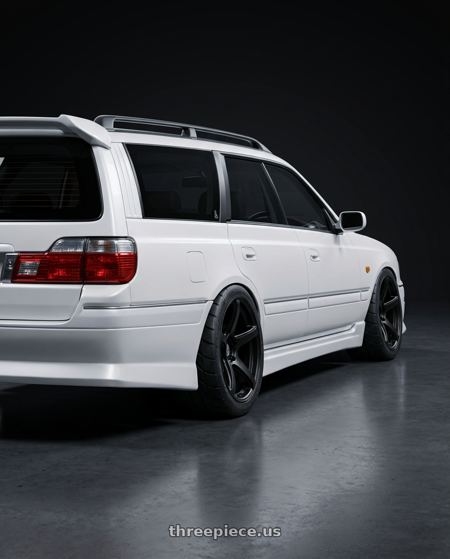1998 Nissan Stagea with Work Emotion T5R wheels rear three quarter view meaty tires