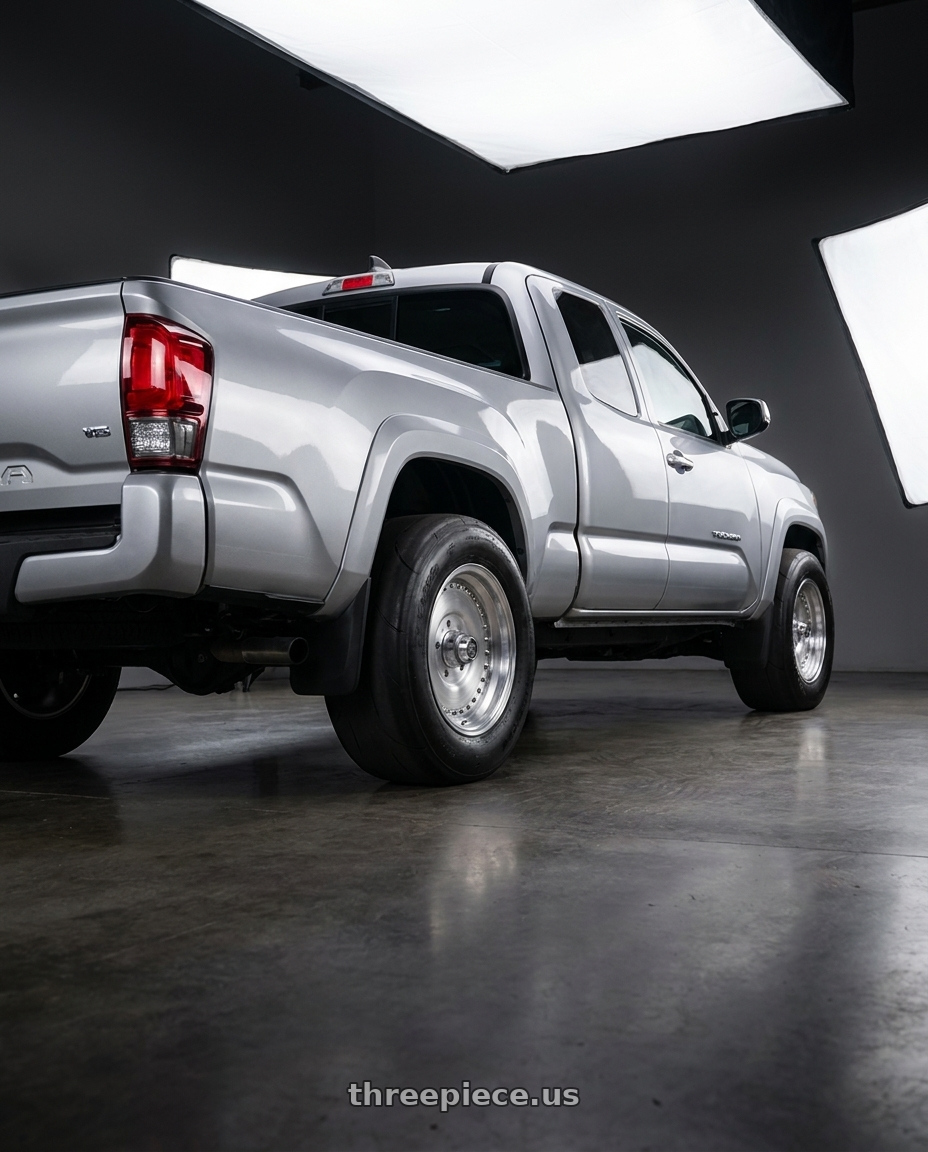 2016 toyota tacoma kingcab with Center Line Auto Drag 2.0 5X114.3 15x10 -16 Brushed wheels rear three quarter view excessive tires
