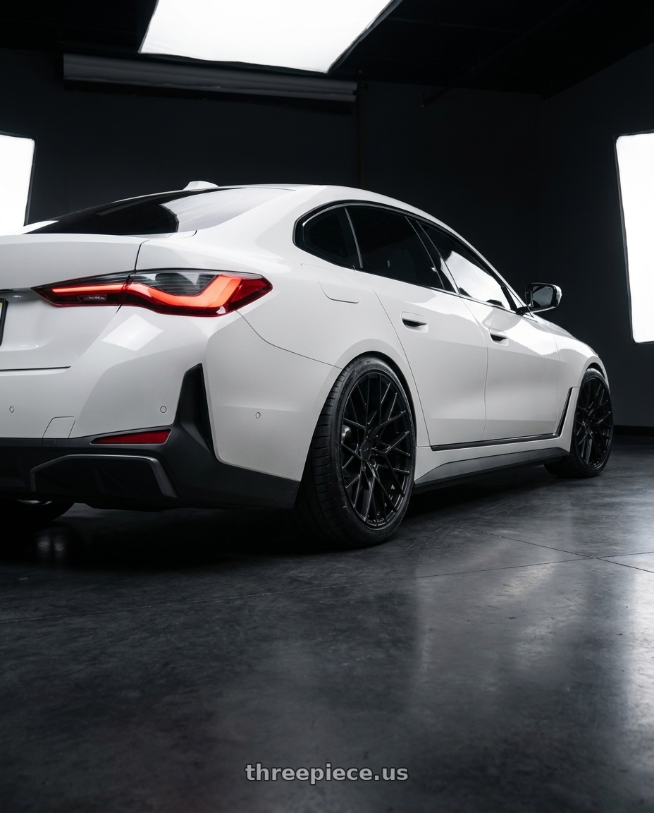 2023 BMW i4 with TSW SEBRING 5X112 20X8.5 +32 MATTE BLACK wheels rear three quarter view meaty tires
