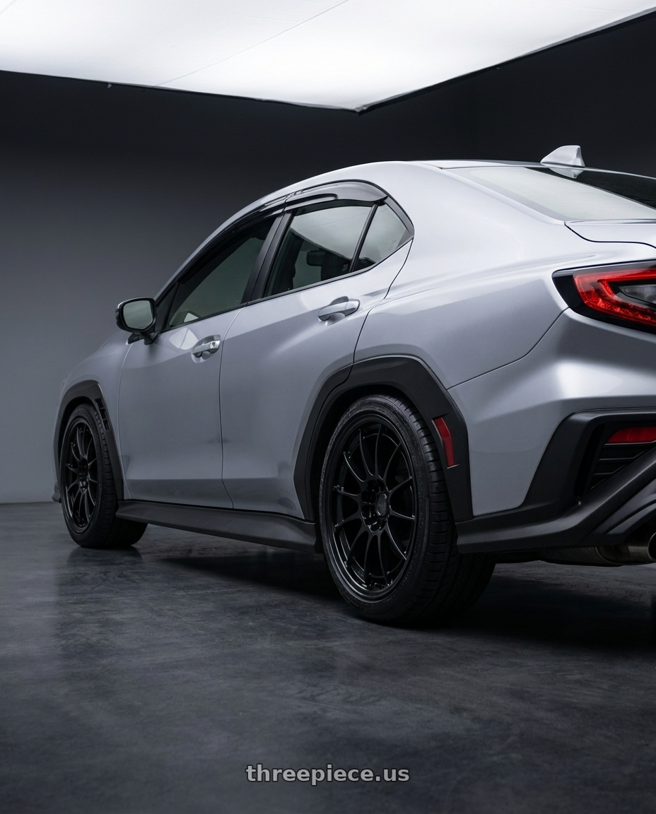 2026 Subaru, WRX Limited, Ice Sliver Metallic with Enkei NT03+M 5x114.3 18x9.5+40 Gloss Black wheels rear three quarter view square tires