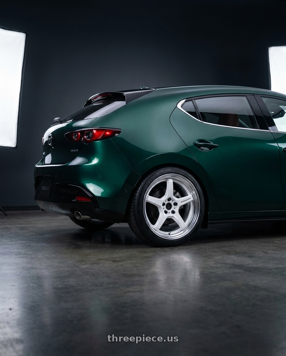 2026 Mazda 3 with Work T5R 2P 5x114.3 18x8.5 +45 WHITE wheels rear three quarter view square tires
