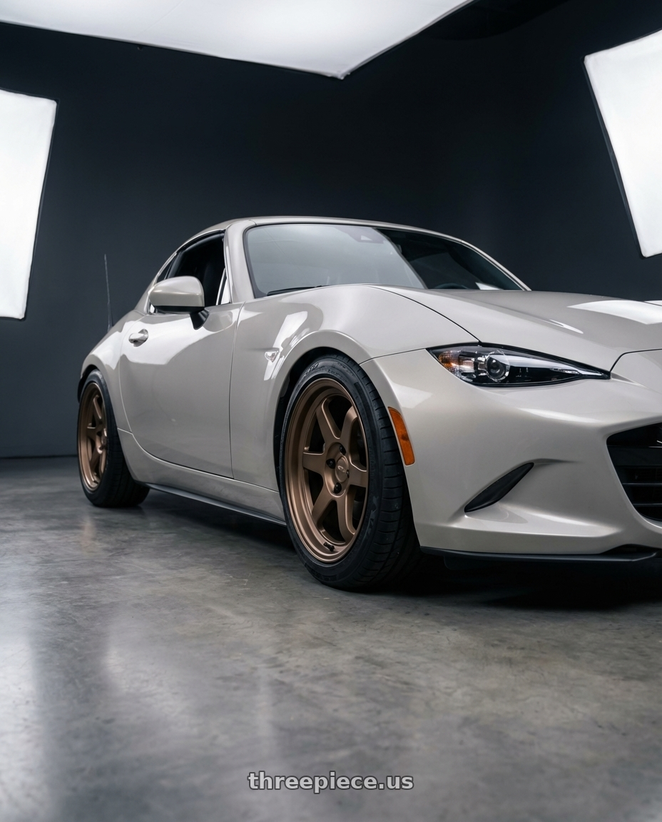 2021 Mazda MX-5 Miata ND with Kansei K12B KNP 5x114.3 17x9 22 Bronze wheels front three quarter view lowered stance