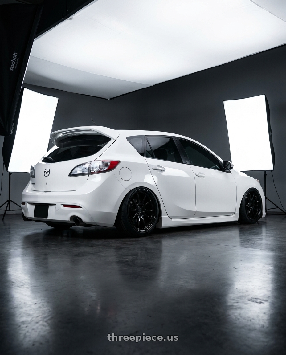 2012 Mazda Mazdaspeed3 with Aodhan AH09 5x114.3 18x9.5 +35 Gloss Silver Machined Face wheels rear three quarter view slight stretch tires