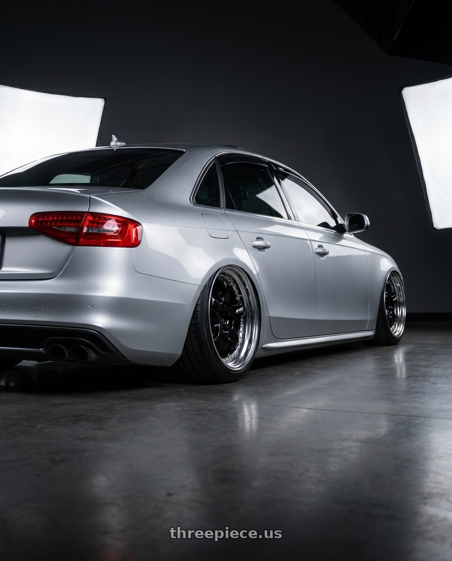 2016 Audi A4 with Work Meister S1 3P 5x112 18x8.5+35 L Disk Black wheels rear three quarter view extreme stretch tires