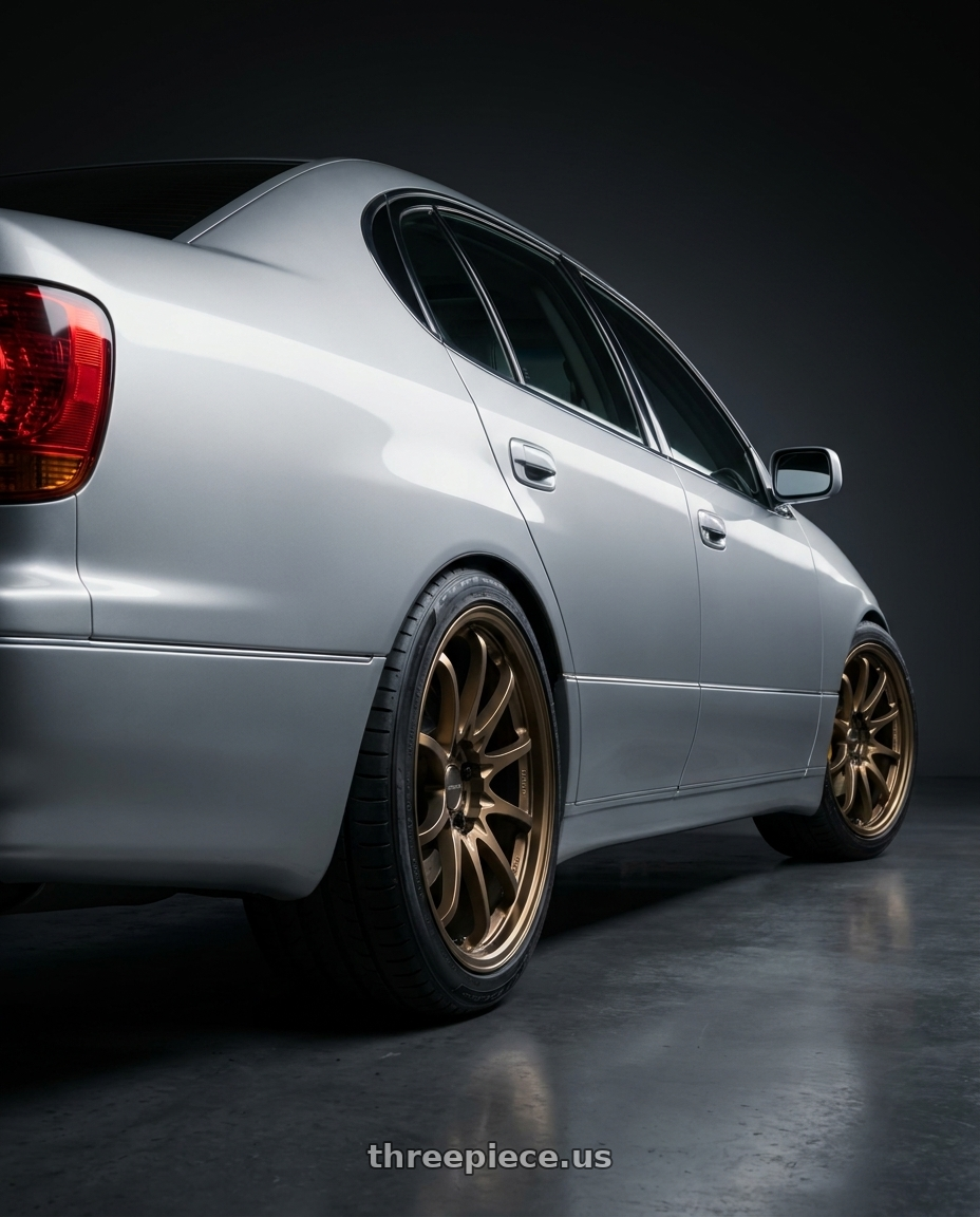 2000 LEXUS GS300 with Volk Racing CE28N-PLUS 5x114.3 18x10.5 +15 SHINING BRONZE METAL wheels rear three quarter view square tires