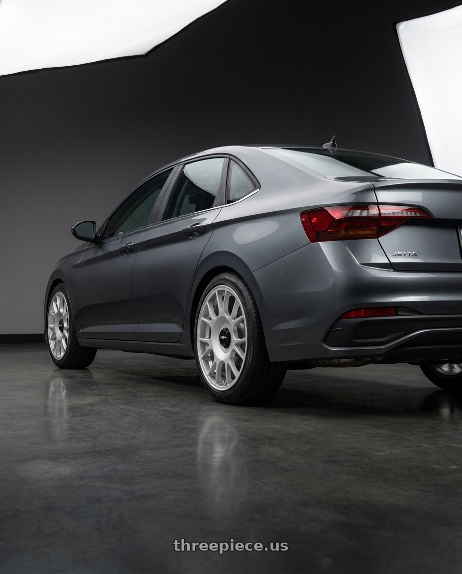 2025 Volkswagen Jetta S dark with Rotiform 1PC R188 TUF-R 5X112 19X8.5 +45 SILVER wheels rear three quarter view square tires