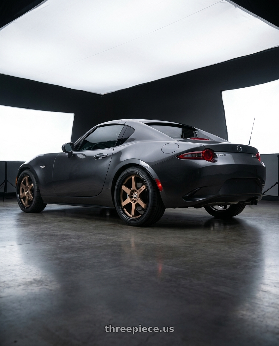 2023 mx-5 miata rf grand touring  with Spec-1 SPT-33 4x100/4x114.3 17x8 +38 Matte Bronze & Black Lip wheels rear three quarter view square tires
