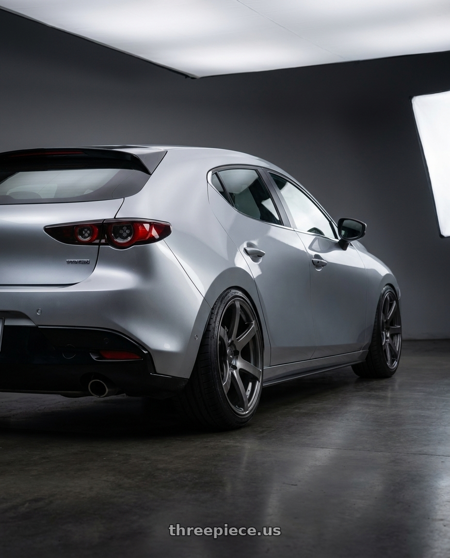 2022 mazda 3 with Enkei PF07 5x114.3 18x8+35 Dark Silver wheels rear three quarter view extreme stretch tires