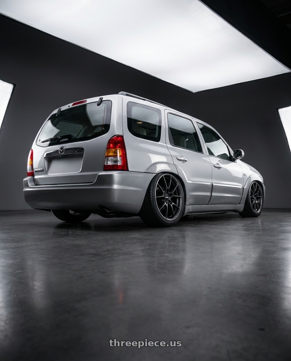 2004 mazda tribute 3.0v6 speed with Volk Racing G025 5x114.3 18x7.5+43 Matte Gunblack / Rim Edge DC wheels rear three quarter view slight stretch tires