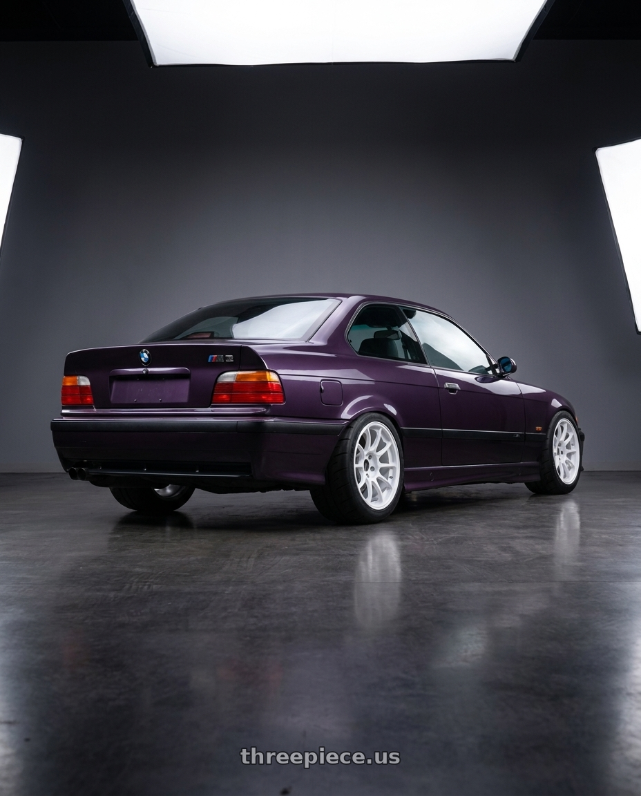 1995 BMW M3 with Volk Racing ZE40 5x114.3 18x10.5+24 Dash White wheels rear three quarter view meaty tires