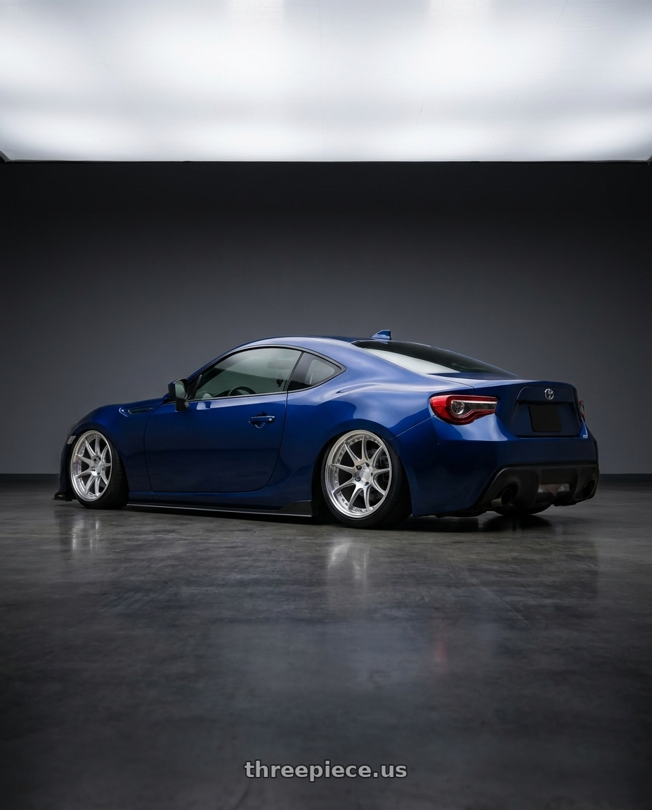 2017 Toyota 86 with Aodhan DS07 5x100 18x8.5+35 Silver w/Machined Face wheels rear three quarter view square tires
