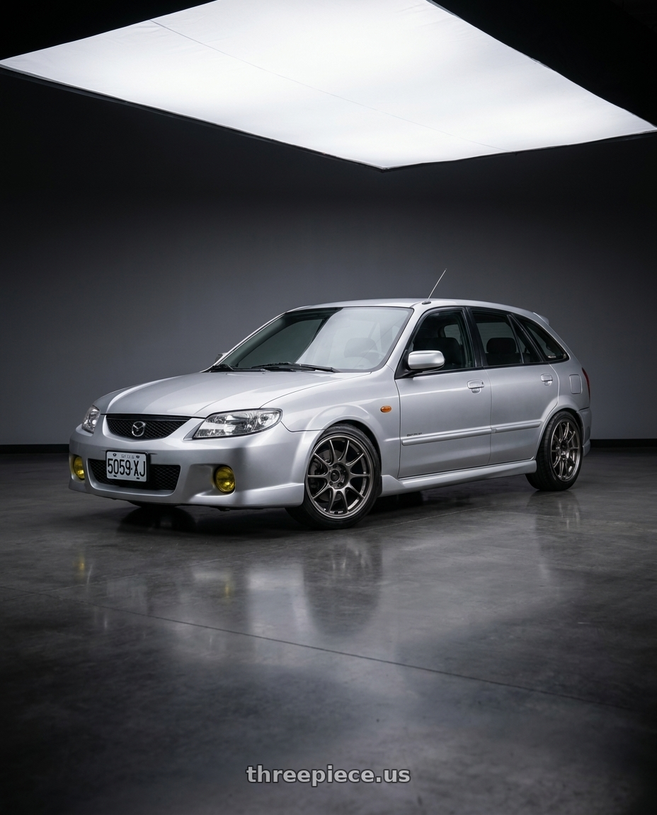Mazda 323 2000 with WedsSport TC105X 4x100 15x8.0+35 EJ Titan wheels