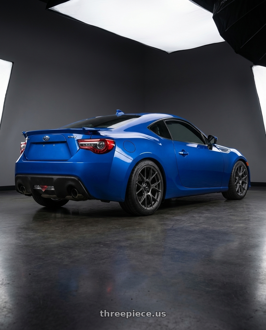 2017 Subaru BRZ with Konig Ampliform 5x100 17x8+40 Dark Metallic Graphite wheels rear three quarter view square tires