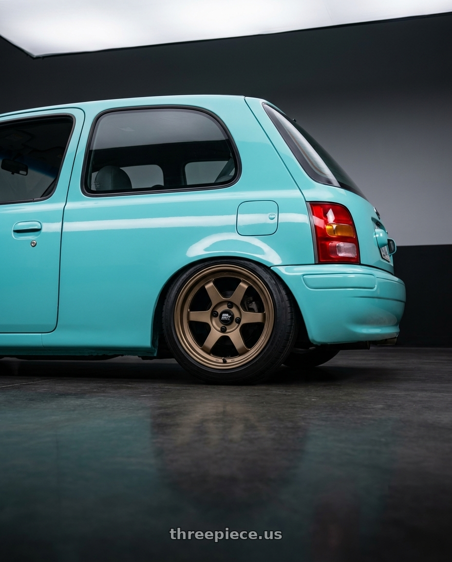 1996 NISSAN MARCH Tiffany Blue with MST Wheels Time Attack 5x100 15x7.0 +20 Matte Bronze wheels rear three quarter view square tires