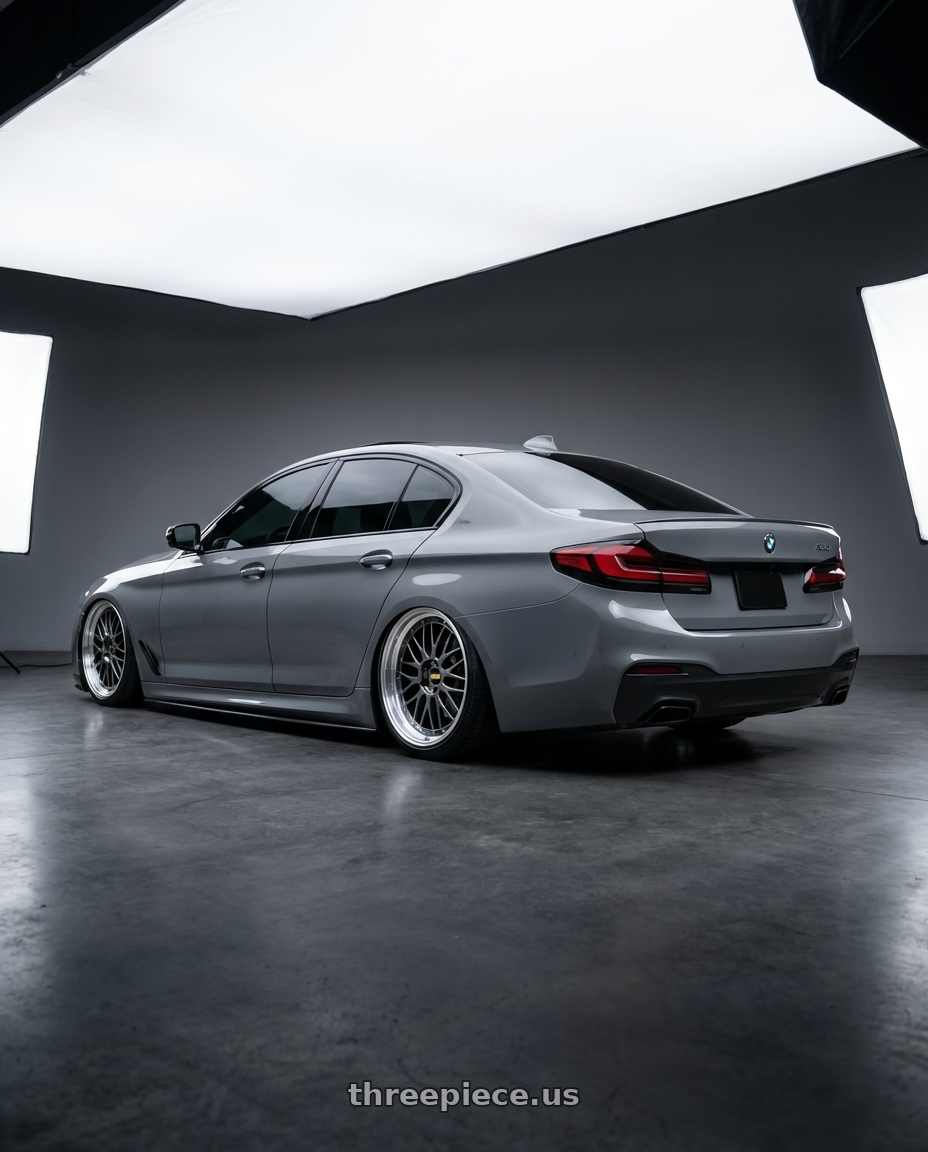 2022 bmw 530i with BBS LM 5x120 20x9.0+15 Diamond Black wheels rear three quarter view slight stretch tires