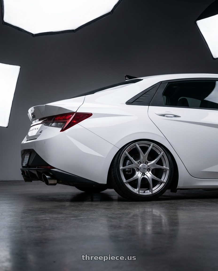 2024 Hyundai Elantra N with Ssr Gtv03 5x114.3 19x8.5+38  GLARE SILVER wheels rear three quarter view slight stretch tires