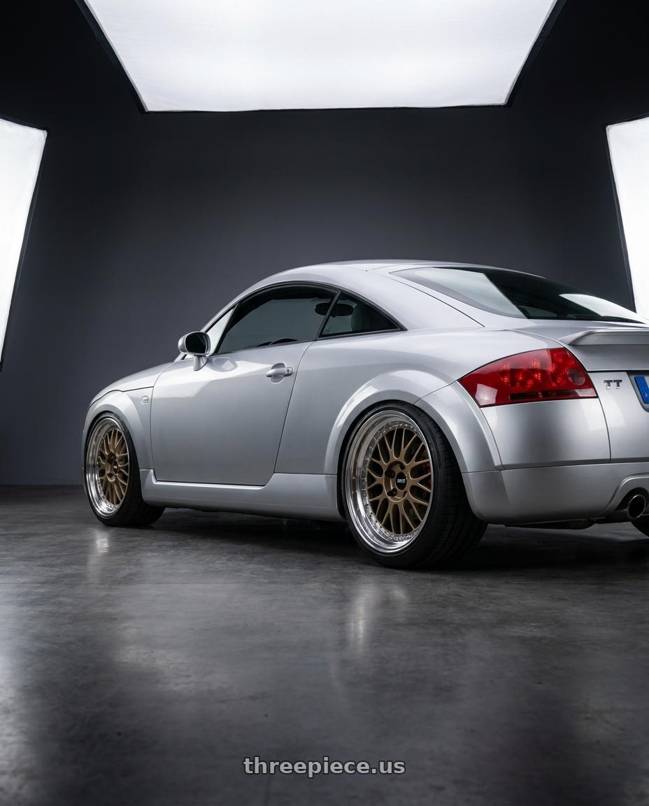 2002 Audi TT quattro with Work Meister M1 3p 5x100 18x8+38 O Disk Titanium Gold wheels rear three quarter view square tires