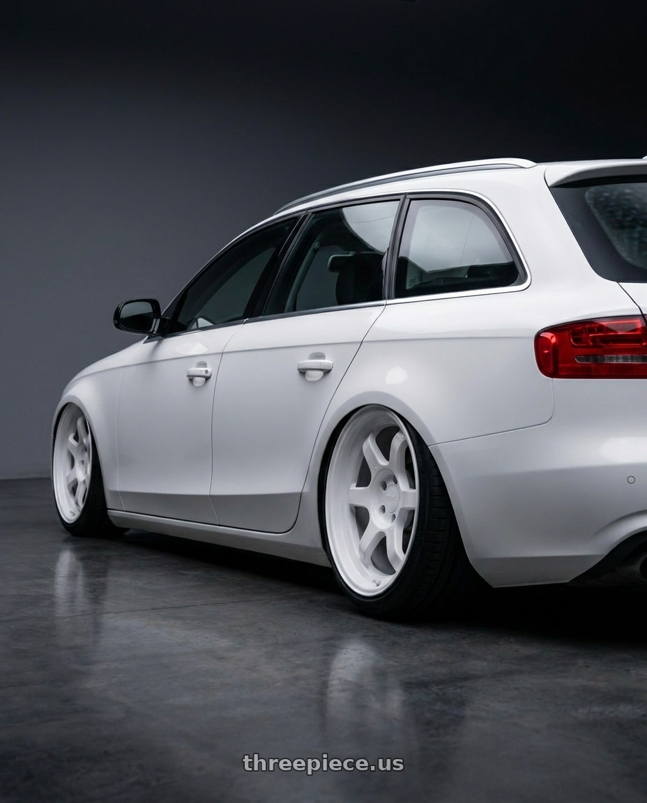 2011 Audi A4 with 9six9 SIX-1 Deep 4x100 15X8 +20 Competition White wheels rear three quarter view extreme stretch tires