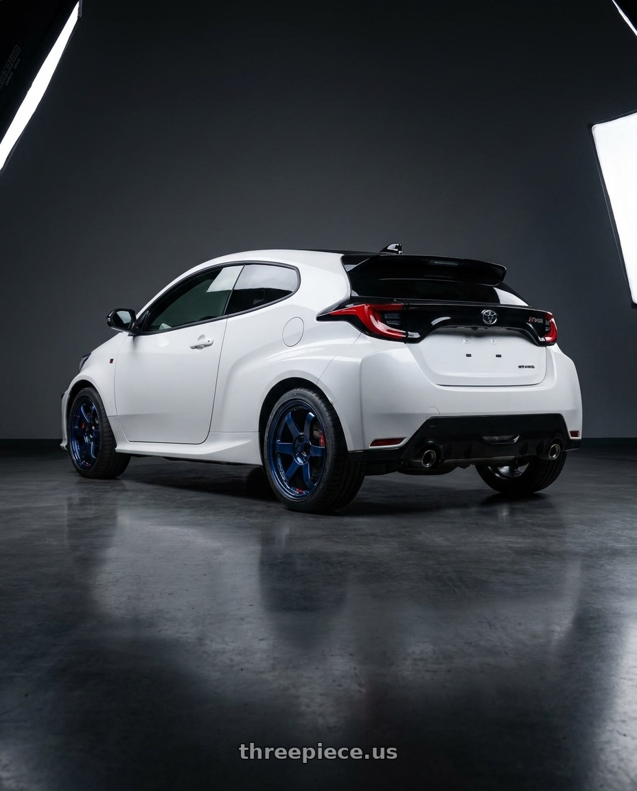 2021 gr yaris with Volk Racing TE37SL 5x114.3 18x10.5 +15 MAG BLUE wheels rear three quarter view square tires