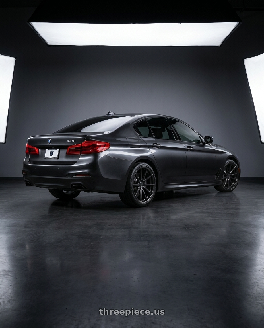 2021 bmw 540 with Rohana RFX1 5x112 20x10+45 Matte Black wheels rear three quarter view square tires
